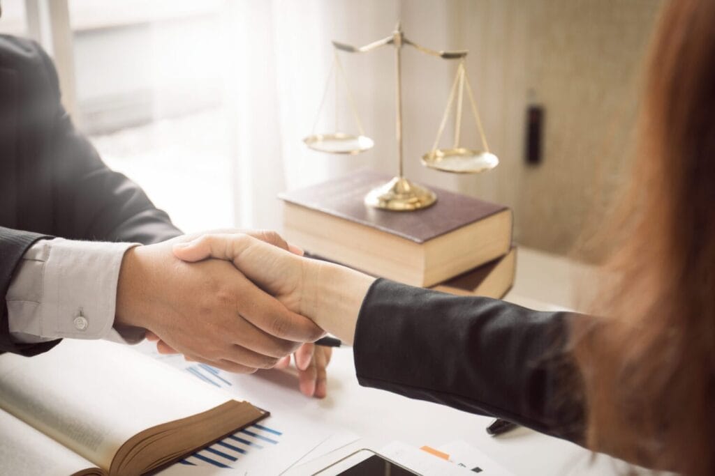 Offers to Settle in Family Law professional shaking hands with divorece lawyer